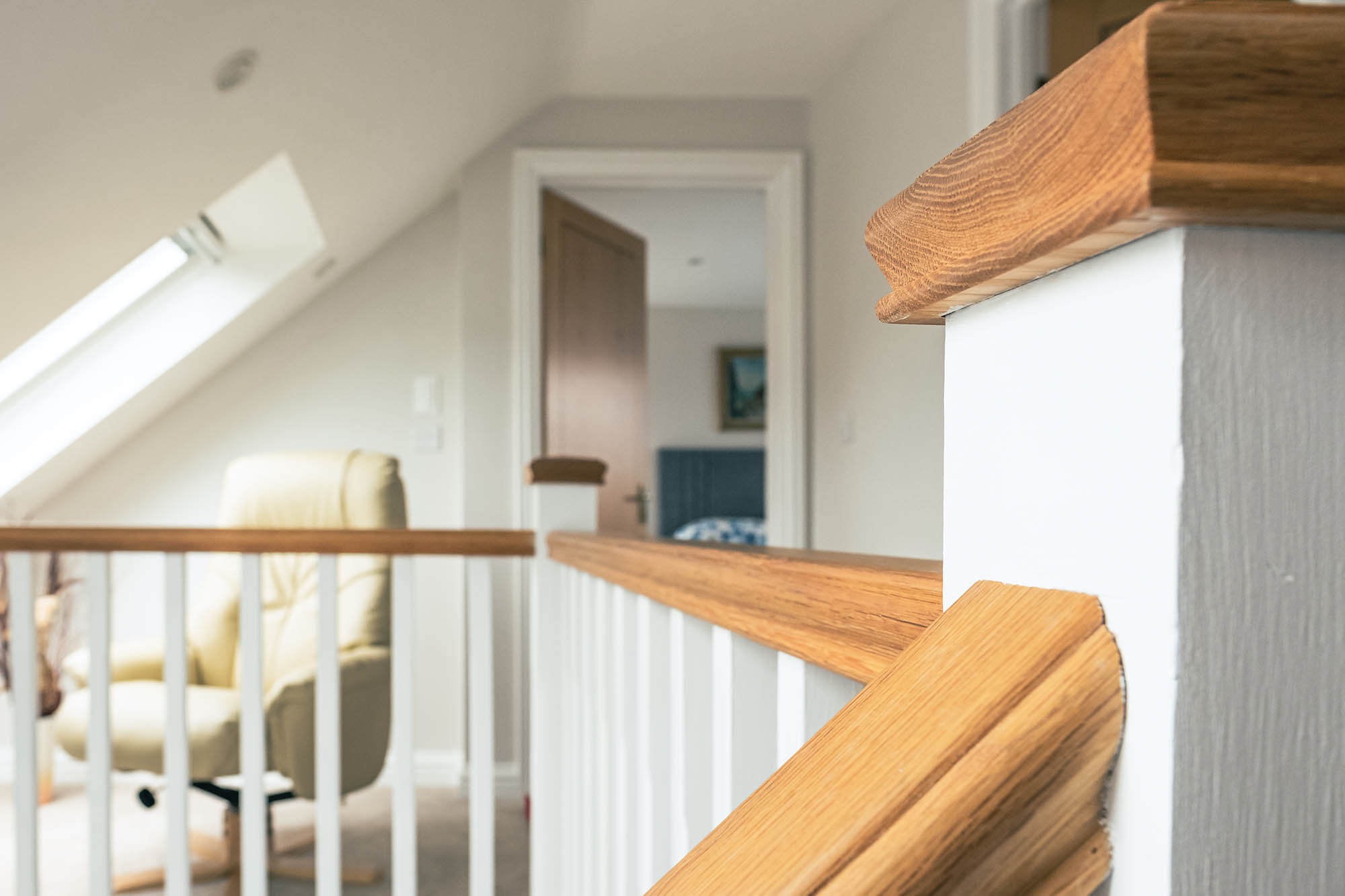 A bespoke staircase leading to a home office loft conversion