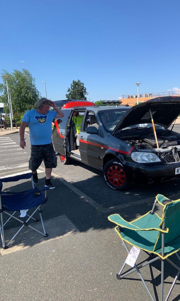 A van with an open bonnet