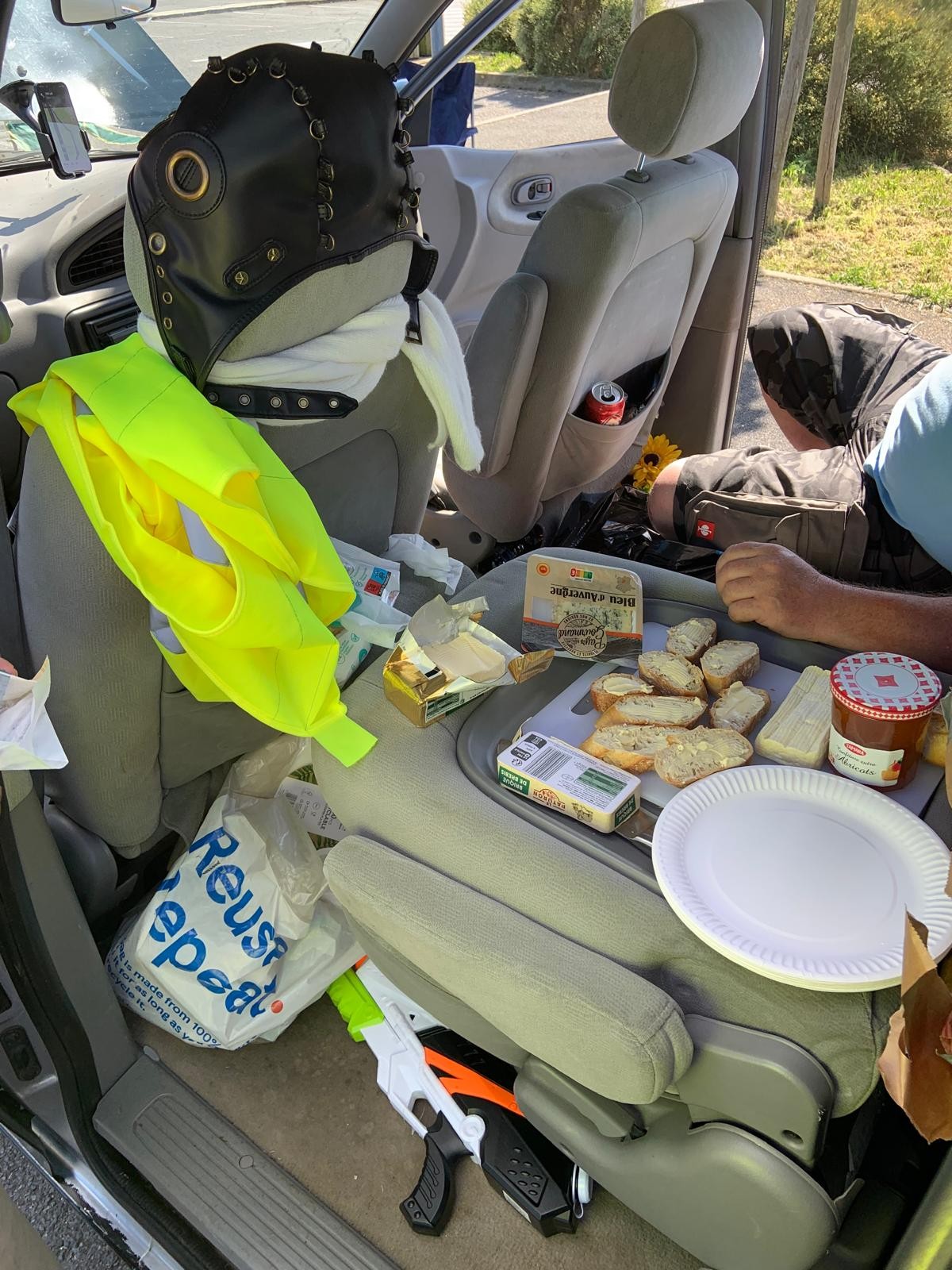 Lunchtime food laid out on a folded down car seat